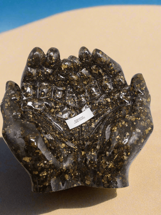 Rock dish giving hands